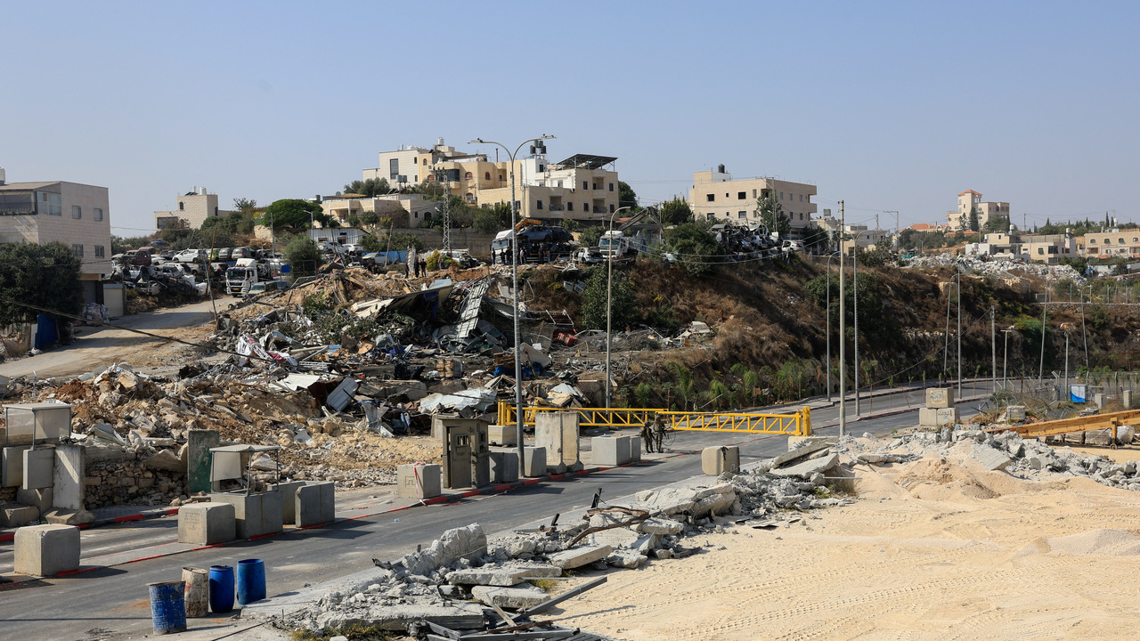 Debris lie at the site of a shooting on Friday, after Israeli forces demolished Palestinian businesses in Hebron